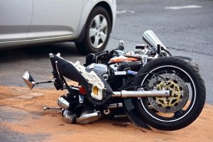 A damaged motorcycle on its side due to accident in Santa Rosa.