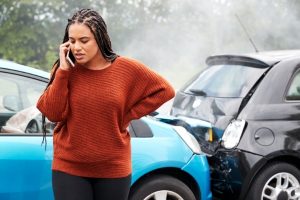 A victim of auto collision calling her attorney in Santa Rosa.